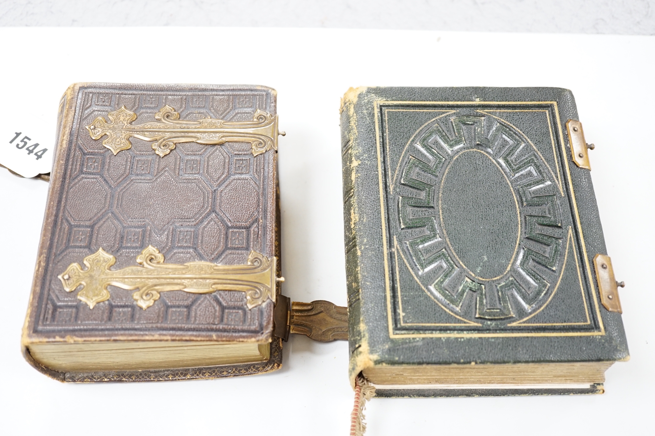 Two Victorian leather portrait photo albums, largest 16cm high, 12.5cm wide